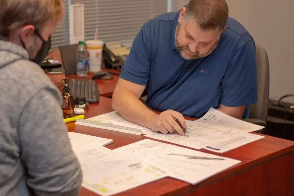 working through new product development with engineer