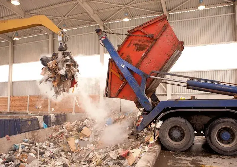 waste truck dumping trash